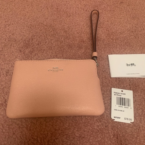 Coach Handbags - NWT COACH LEATHER WRISTLET. Petal pink/Silver